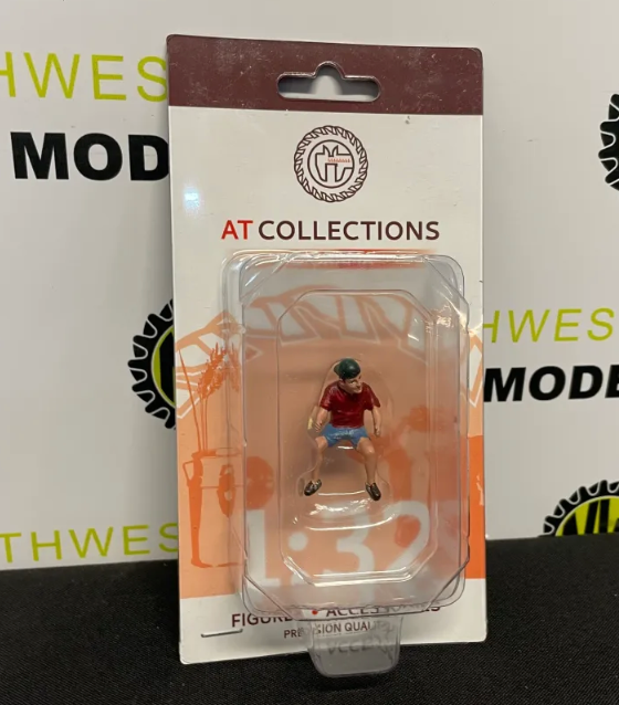 AT COLLECTIONS 1:32 SCALE 32141 TEENAGER JEFF DRVING TRACTOR