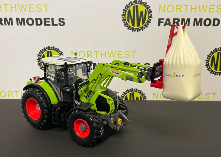 UNIVERSAL HOBBIES 6636 1:32 SCALE CLAAS ARION 550 WITH FRONT LOADER AND BAG"CORN OF FAME"
